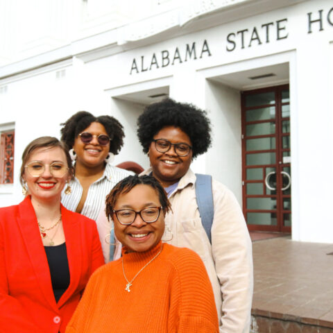 URGE advocates in front of the Alabama State House