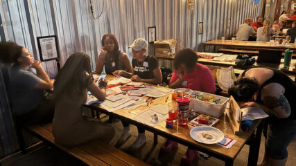 URGE postcard writing party.