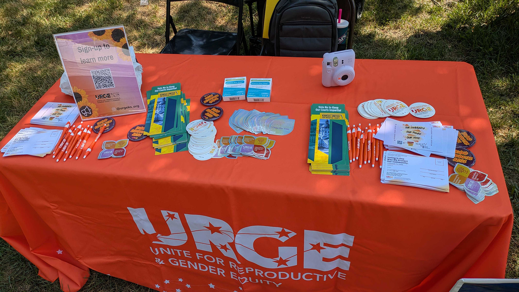 URGE information table with voting handouts.