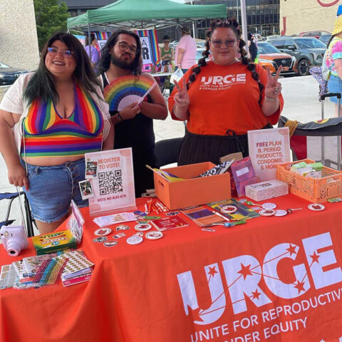 URGE information table with voting handouts.