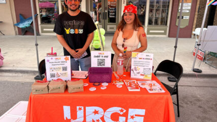 URGE information table with voting handouts.